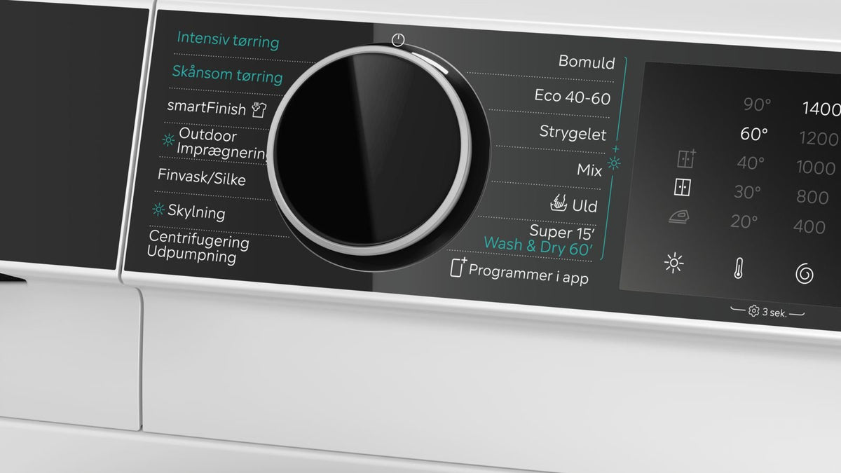 Nærbillede af programvælger og display på en Siemens vaske-tørremaskine
